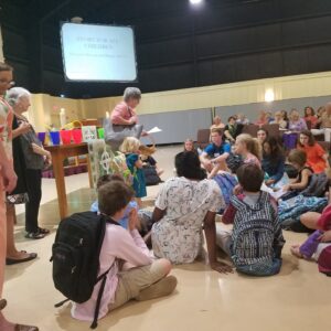 Joan leading worship with kids
