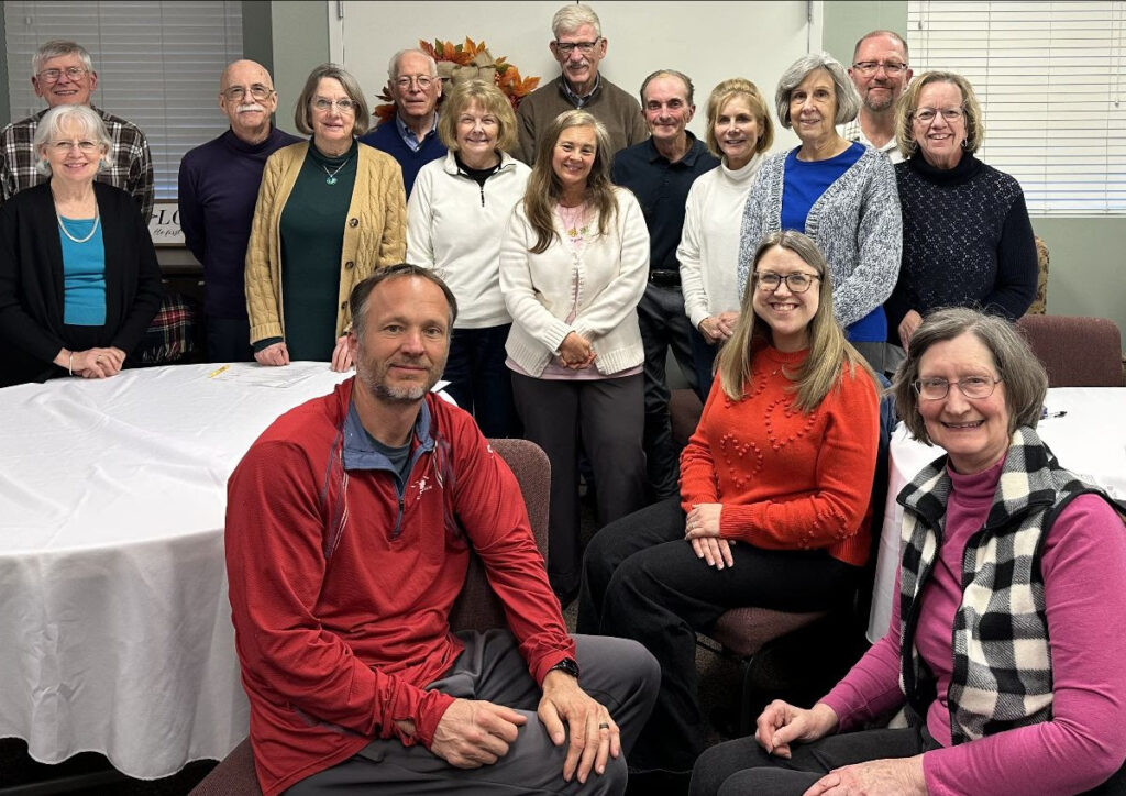 Rooted & Relevant Group smile and gathering around for a picture. 